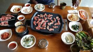 Grilling meat and banchan posted by Christabel Frazier